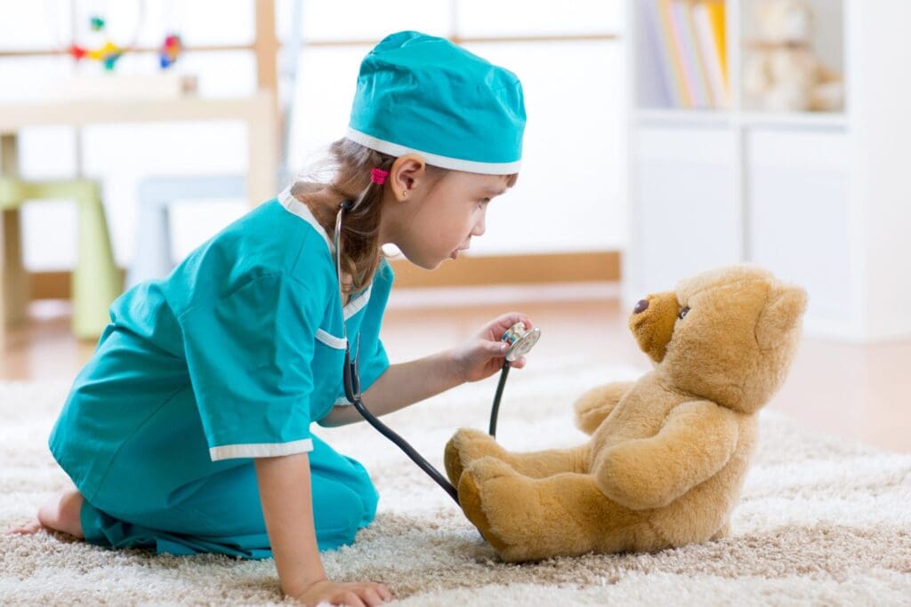 Child pretending she is a doctor in hospital