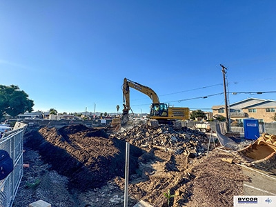 Heavy construction equipment begin site preparation